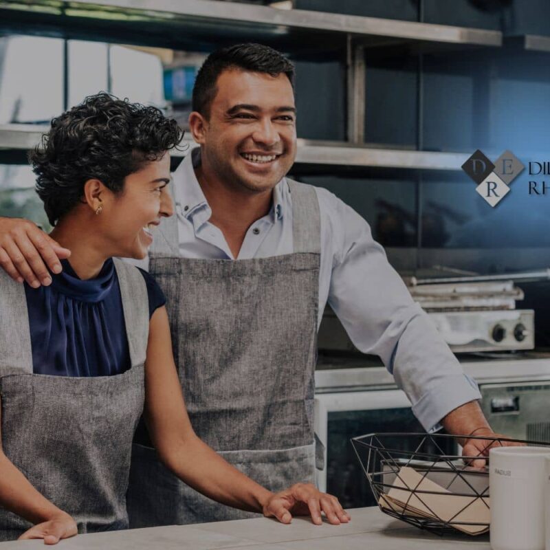 Entrepreneurs in a professional kitchen setting, representing the businesses that Dill, Evans & Rhodeback protects from common small business mistakes.