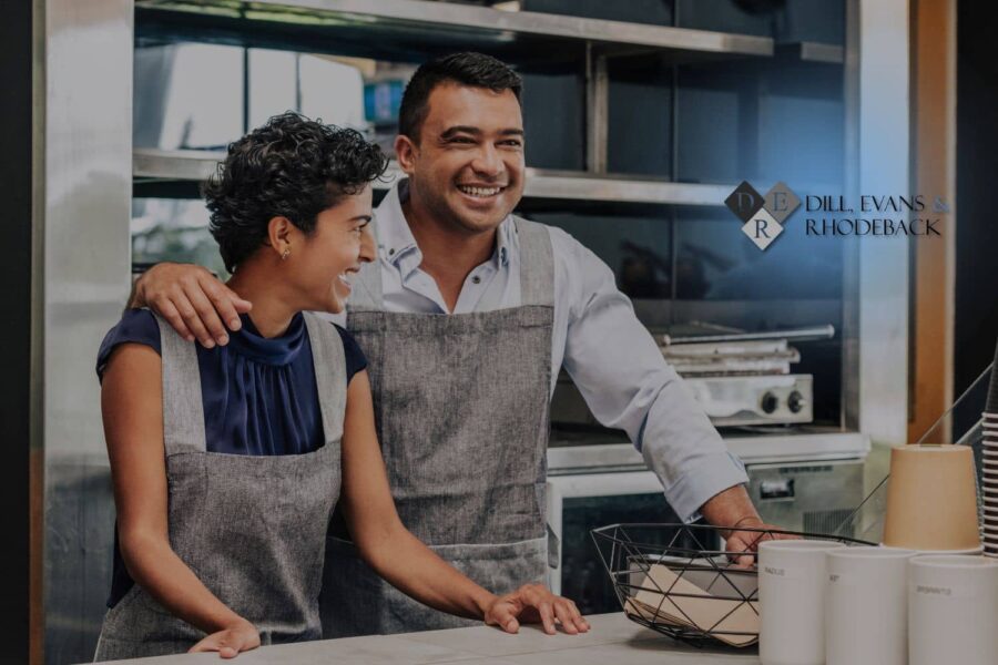 Entrepreneurs in a professional kitchen setting, representing the businesses that Dill, Evans & Rhodeback protects from common small business mistakes.